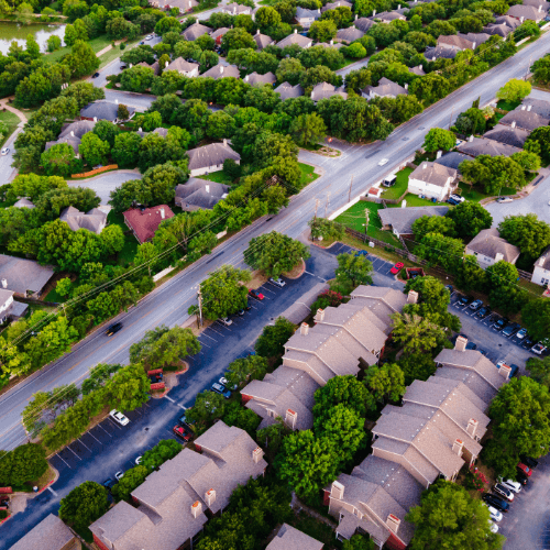 Aerial view of residential neighborhood with houses and roads for land development report service
